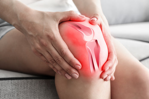 Woman suffering from pain in knee