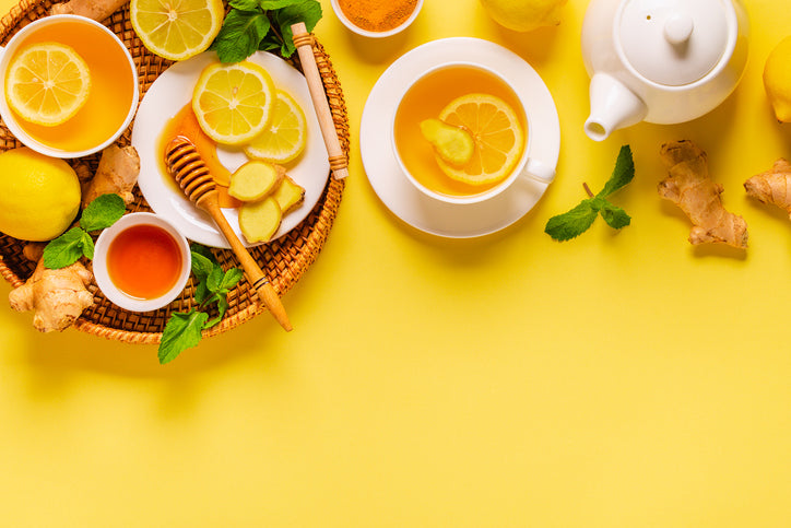 Lemon slices and honey on a yellow background