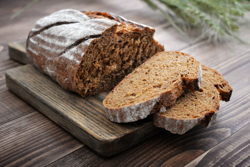 sliced rye bread on cutting board