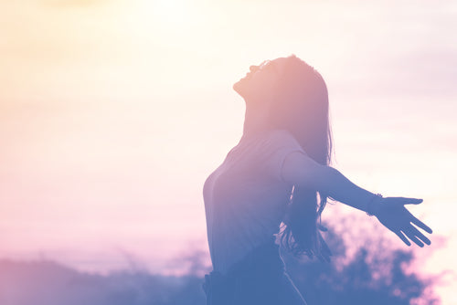 woman relaxing in summer sunset