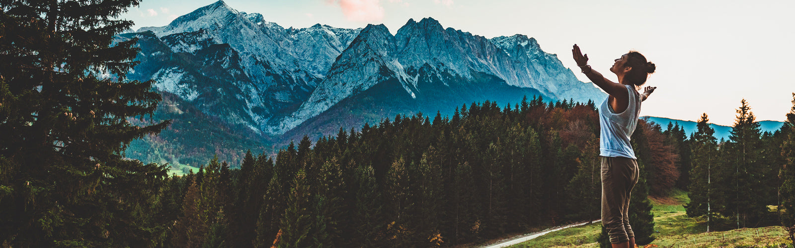 Woman on a hike embracing the mountainous scenery