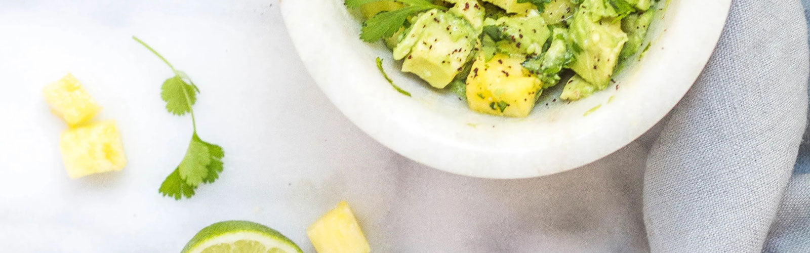 Healthy vegan snack made with radishes, avocado, pineapple, and cilantro