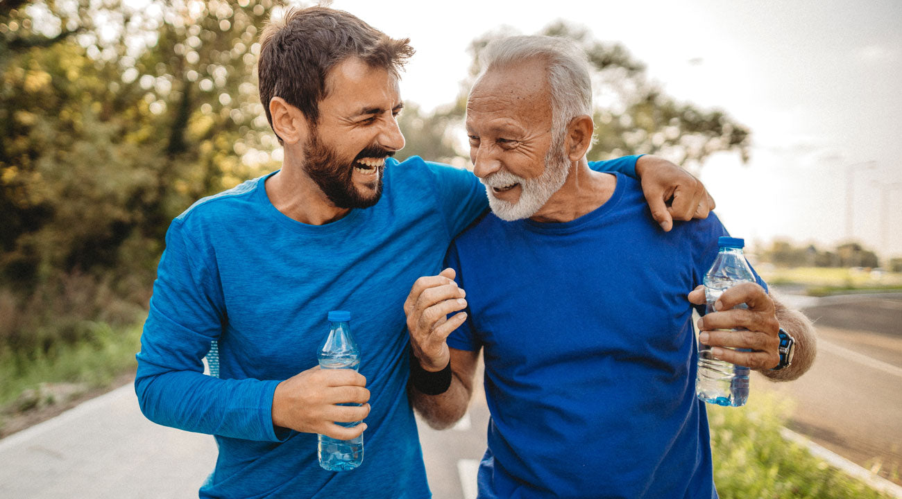 Father and son going for a walk and drinking water