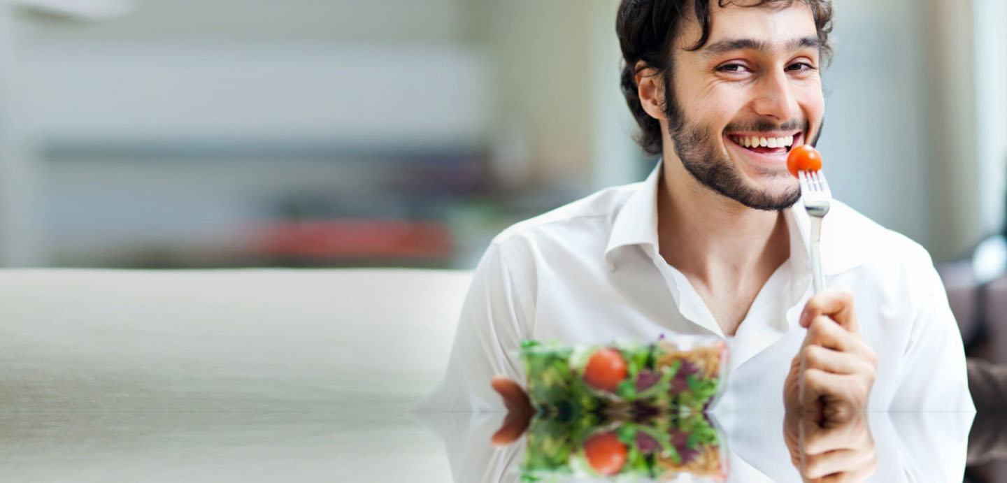 Man eating healthy vegan vegetable salad