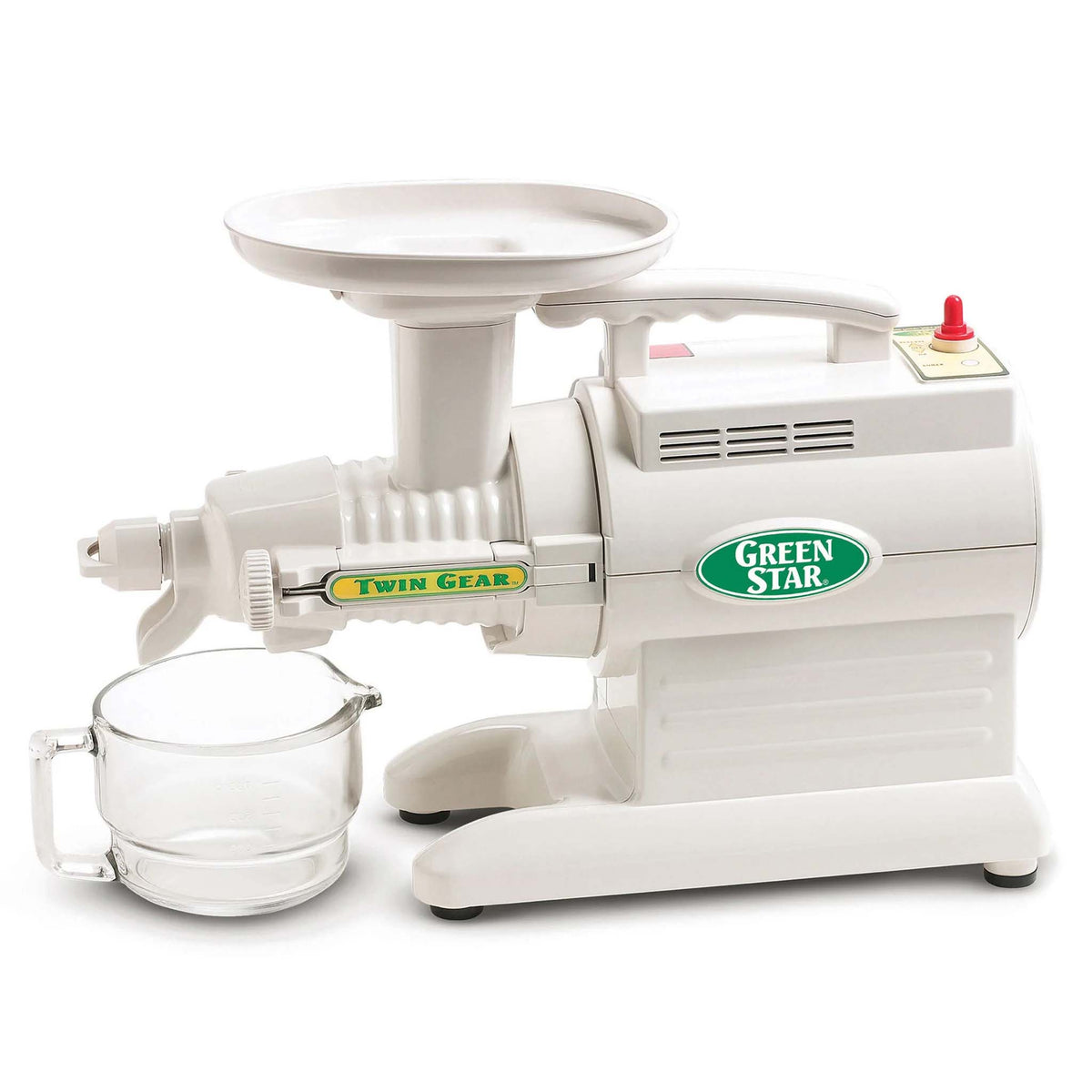 Green Star Twin Gear Juicing machine with a glass mug