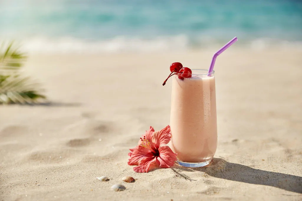 Coconut Blubarb Smoothie - a creamy pale smoothie garnished with cherries