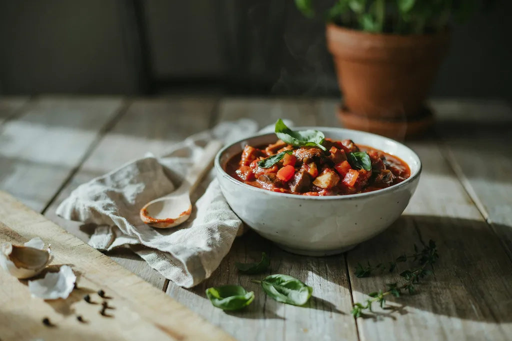 Red Pepper and Mushroom Marinara Sauce - a bowl of rich red marinara sauce with basil
