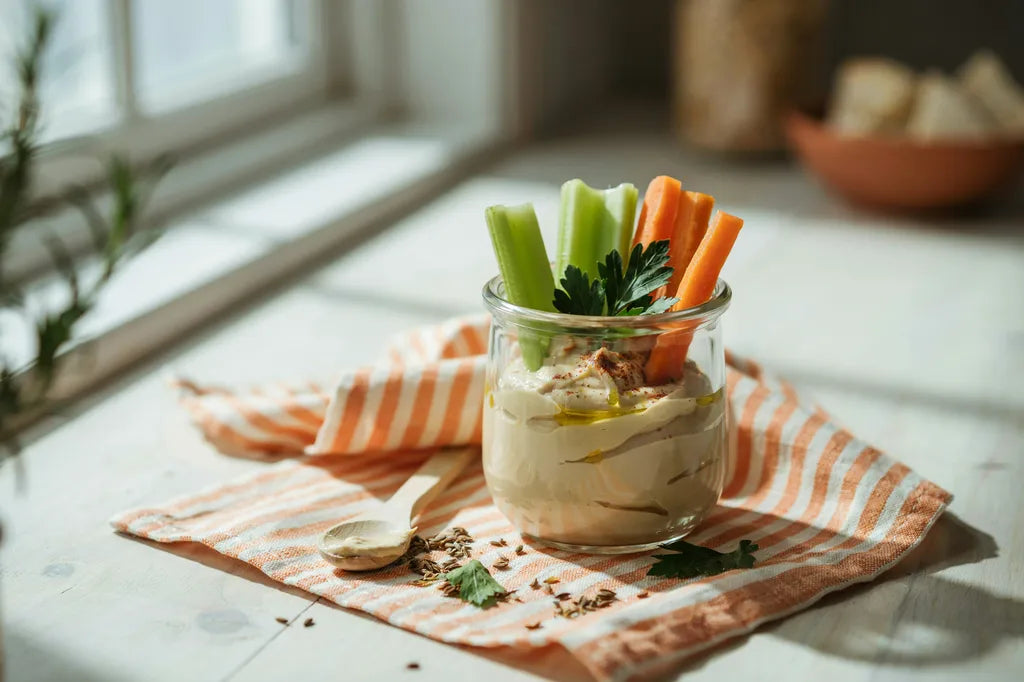 Celery Dip - a jar of creamy tahini dip with celery and carrot sticks