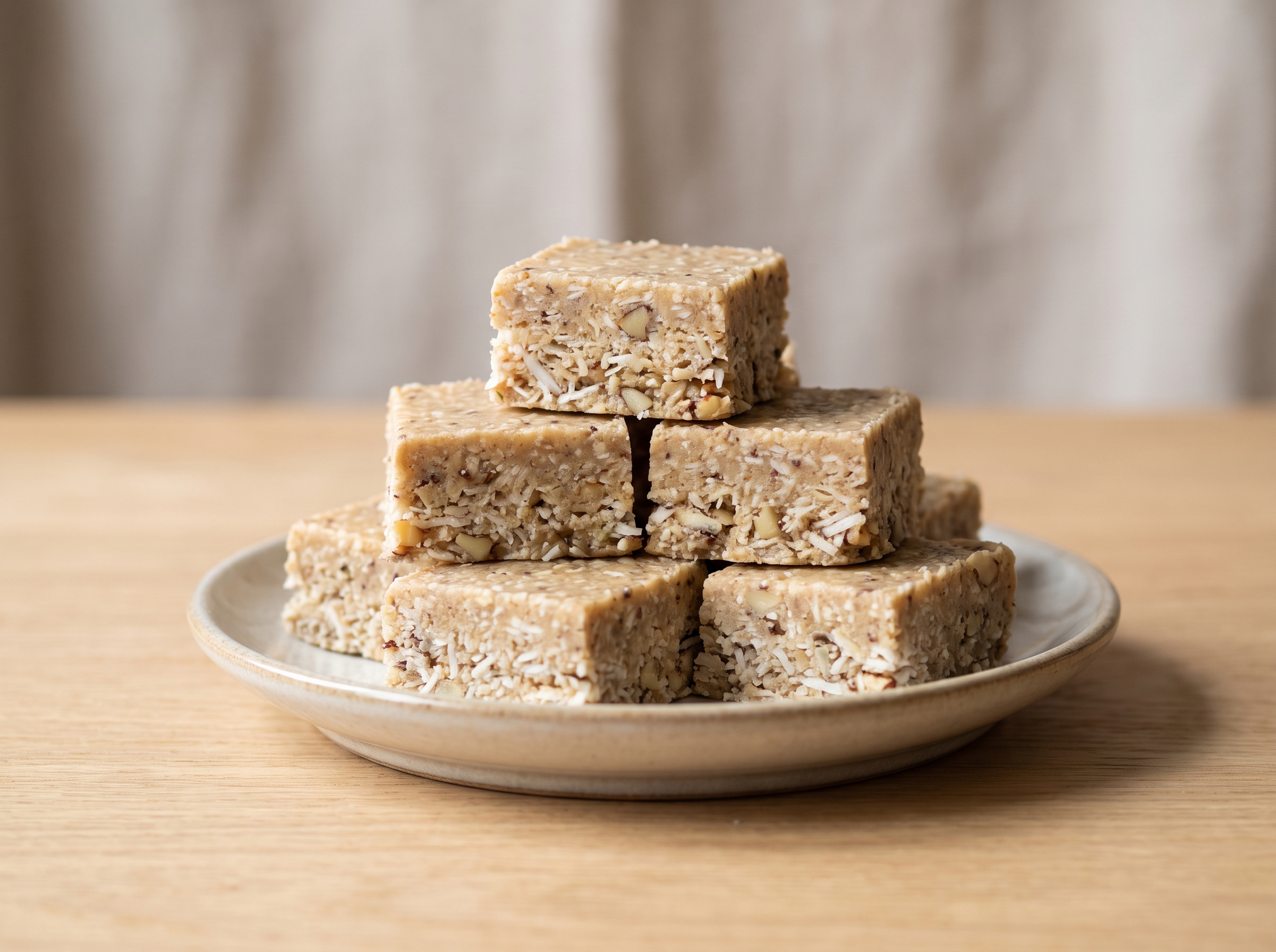 Tahini crunch bar made with tahini, almond butter, raw carob and shredded coconut