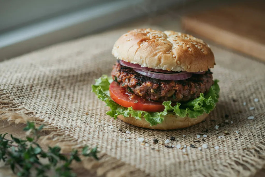Bean and Brown Rice Burgers - a veggie burger patty on a bun with lettuce and tomato