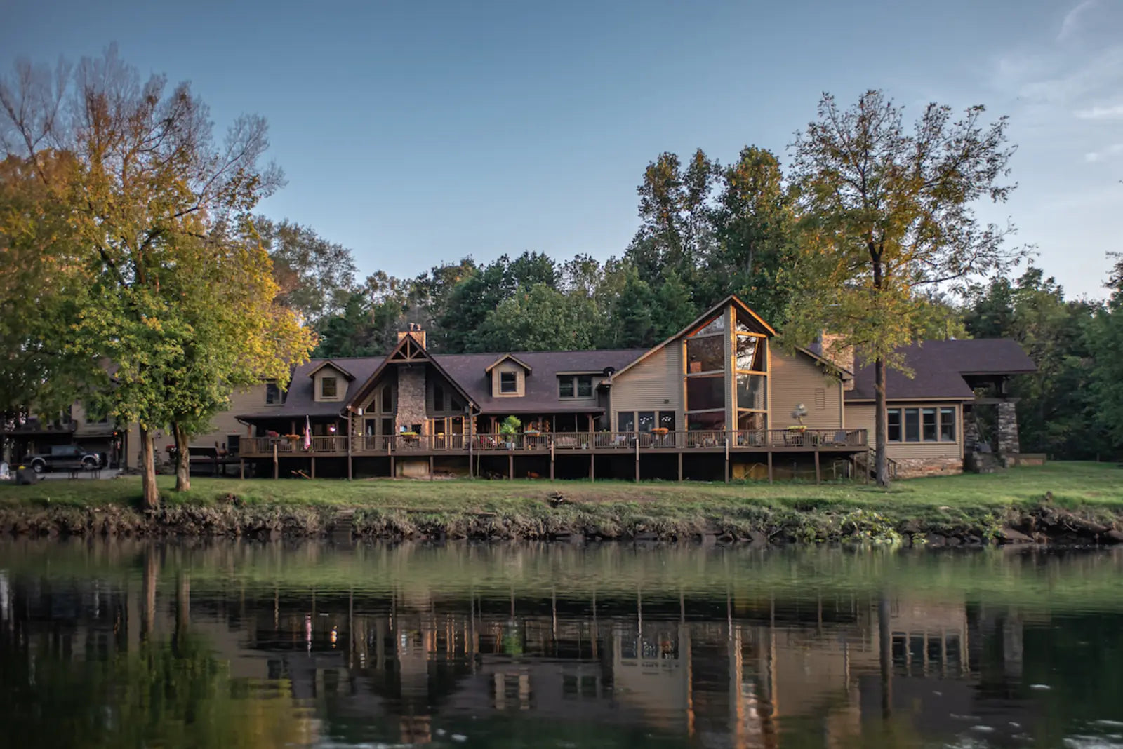 The Hallelujah Health Retreat lodge seen across the water in autumn, near Kingston, Georgia.