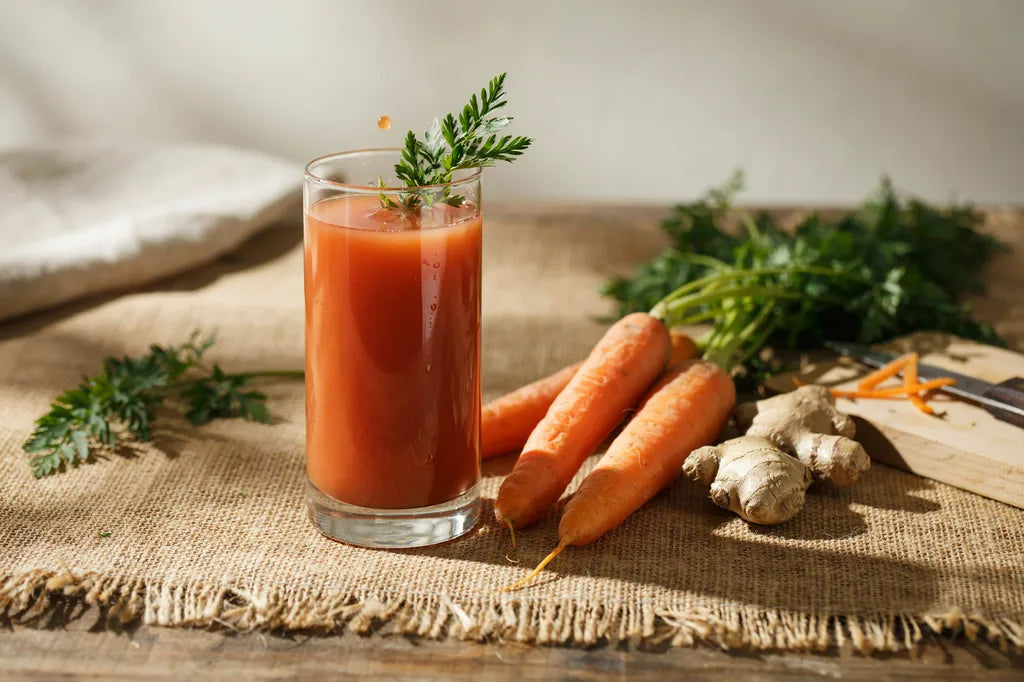 Harvest Sunset Juice - a glass of vibrant orange juice with fresh carrots and ginger