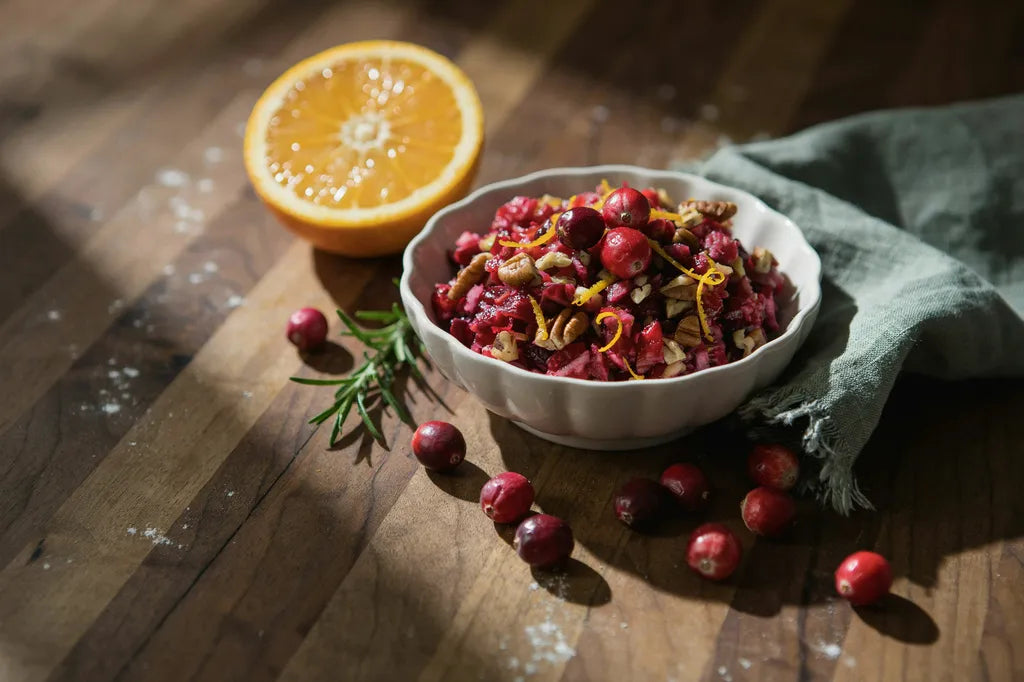 Ginger Cranberry Relish - a scalloped bowl of bright pink-red cranberry relish