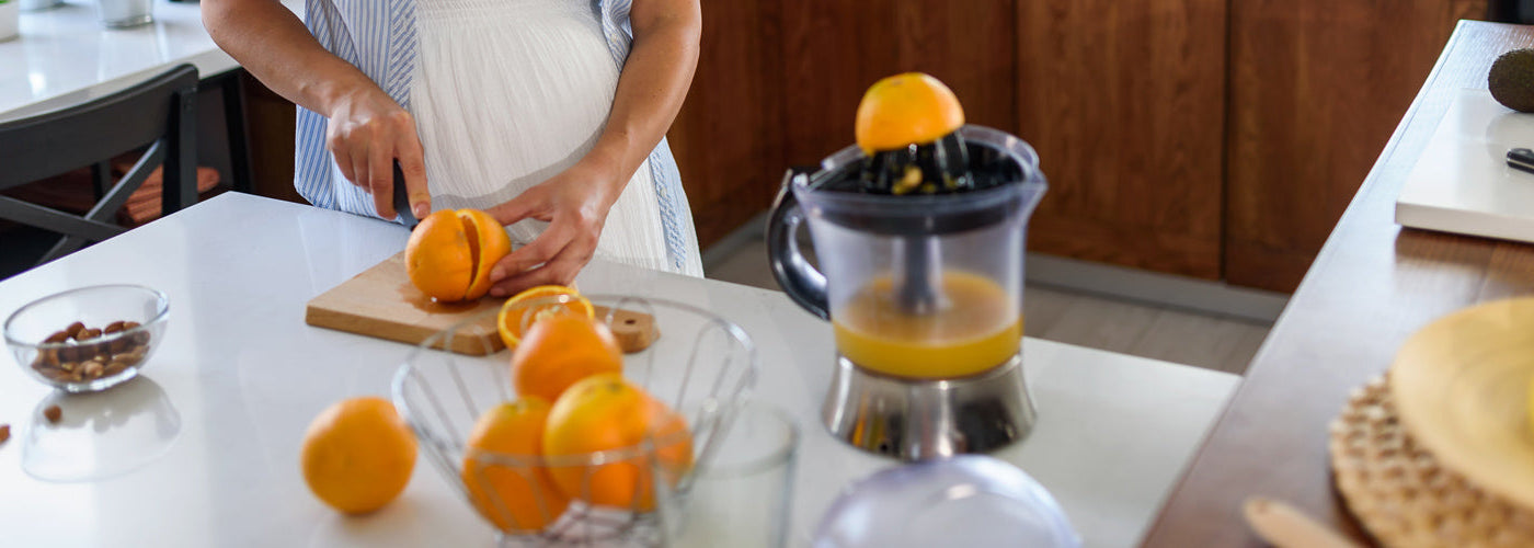 Preparing fresh-squeezed orange juice
