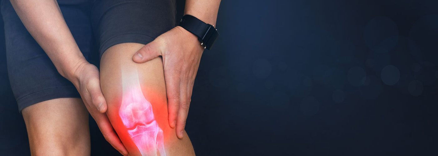 Man feeling joint pain in his knee